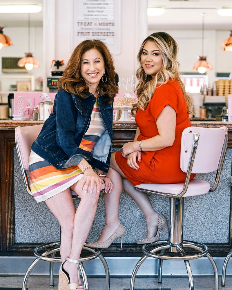 Rhonda Rush and Kimberli Stone of Impact Events seated at a vintage soda fountain counter